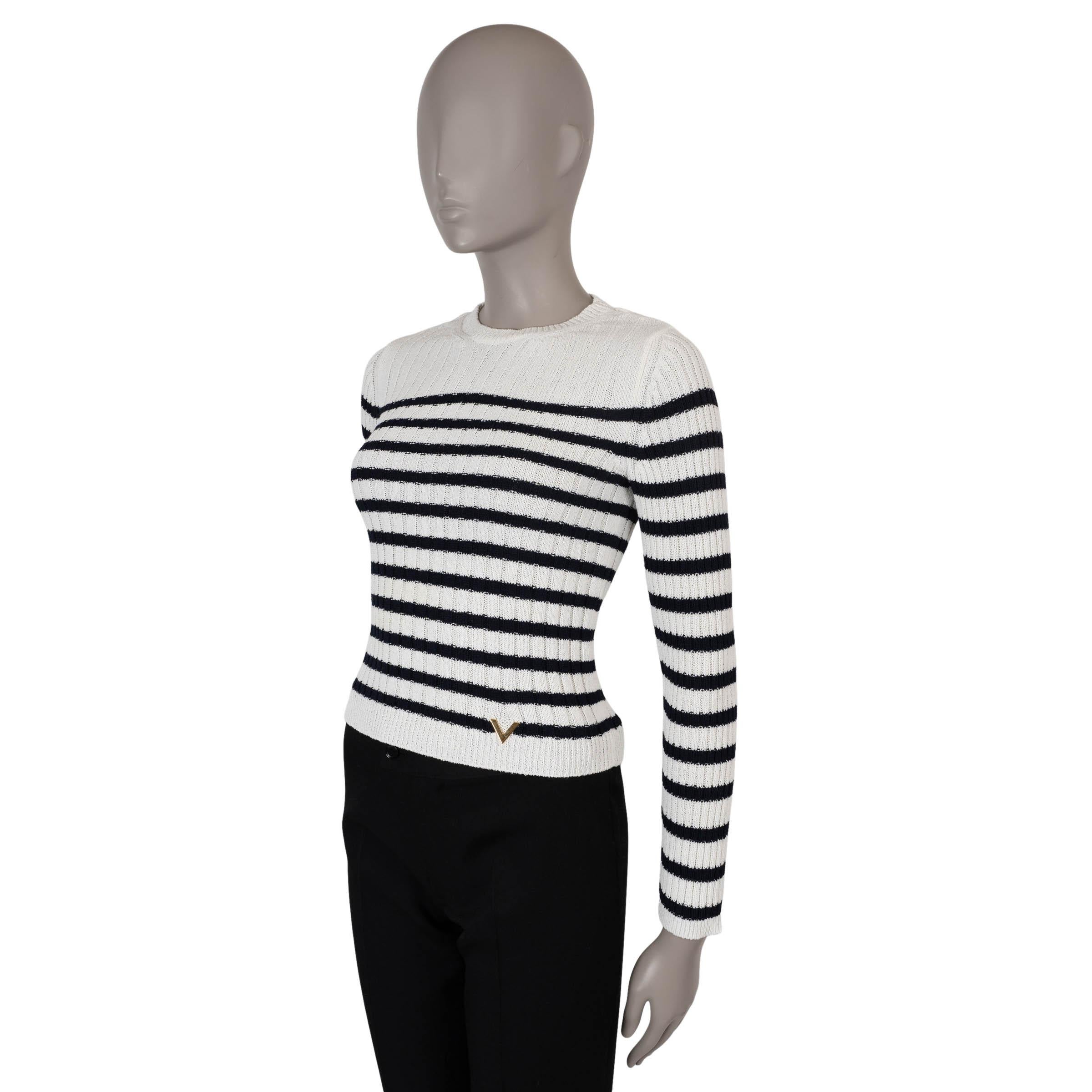 This 100% authentic Valentino sweater in white rib-knit viscose (70%) and polyamide (30%) reimagines classic nautical style with modern sophistication. Featuring navy blue stripes, a fitted silhouette, and a crewneck, it is detailed with rib-knit