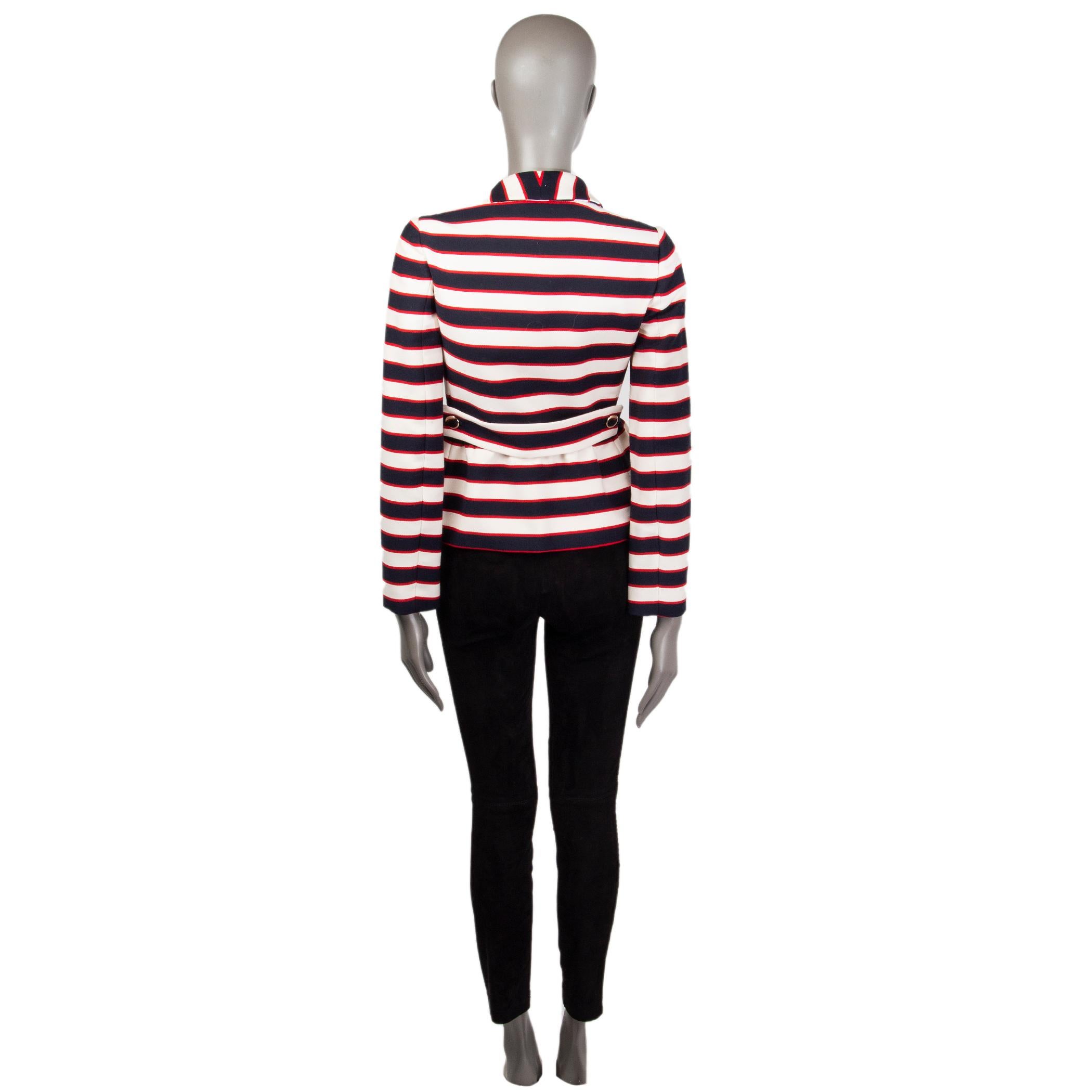 100% authentic Valentino nautical striped blazer in navy, red, and off-white virgin wool (85%) and silk (15%). With flat collar, three button-decorated folded patch pockets onthe front, gathered waist, and two-button waistband on the back. Closes