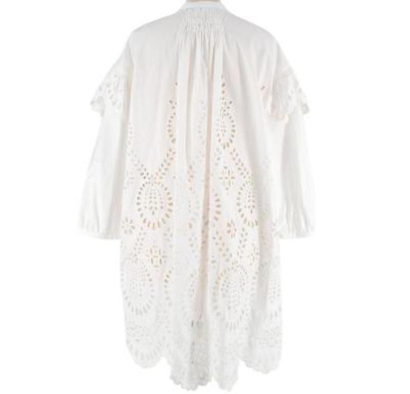 Valentino White Broderie Anglaise Cotton Dress with Bow Neck Tie

- White cotton broderie anglaise long-sleeved dress 
- Round neck with ribbon tie 
- Open seam detail down the front 
- Plain cotton sleeves with shoulder detail
- Oversized relaxed