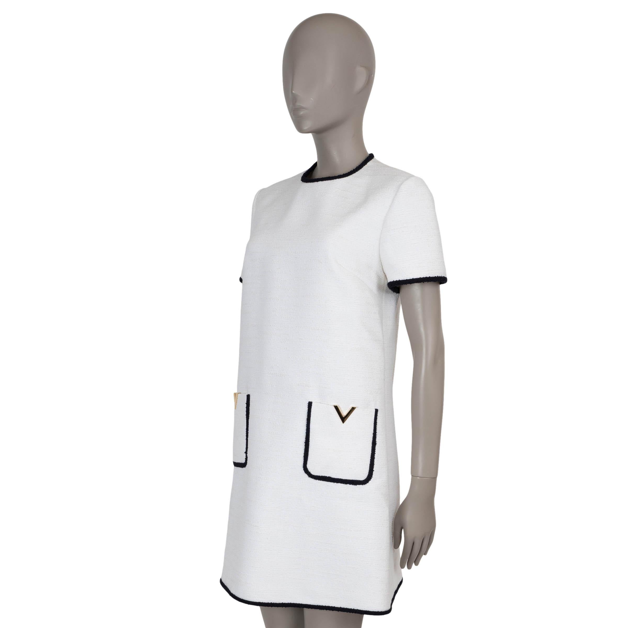 This 100% authentic Valentino Crisp dress in white tweed cotton (31%), viscose (31%), wool (18%), llama wool (11%), and polyamide (9%)—please note the content and size tag are missing—embodies effortless elegance with a modern edge. Designed with a