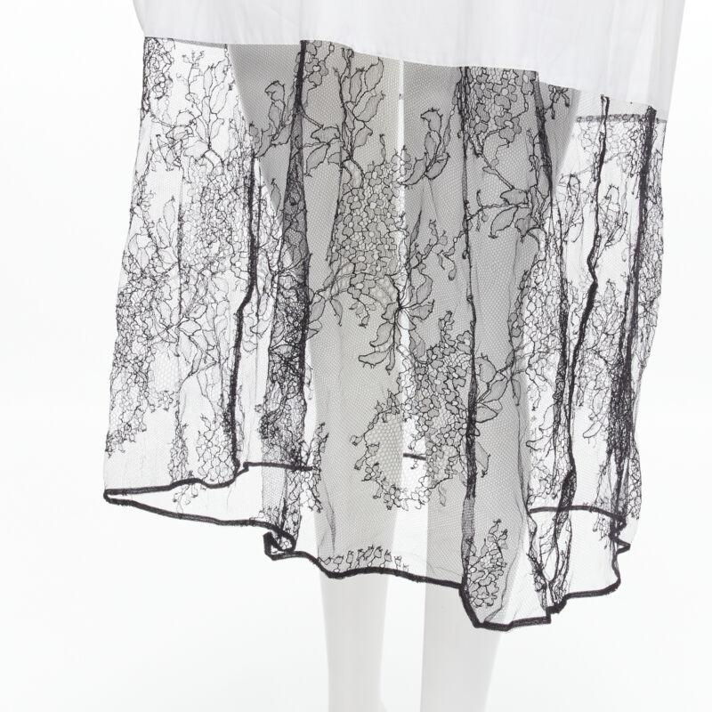 VALENTINO white cotton black floral lace hem shirt dress IT36 XS
Reference: MELK/A00126
Brand: Valentino
Designer: Pier Paolo Piccioli
Material: Cotton, Lace
Color: White, Black
Pattern: Solid
Closure: Button
Extra Details: Textured collar and