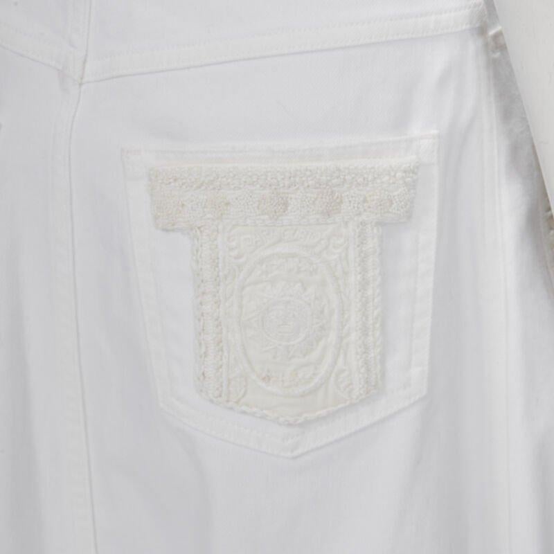 VALENTINO white denim butterfly bead embellished patch raw midi skirt IT38 XS
Reference: KNLM/A00207
Brand: Valentino
Designer: Pier Paolo Piccioli
Material: Cotton
Color: White
Pattern: Solid
Closure: Button
Lining:  Unlined
Extra Details: 5-pocket