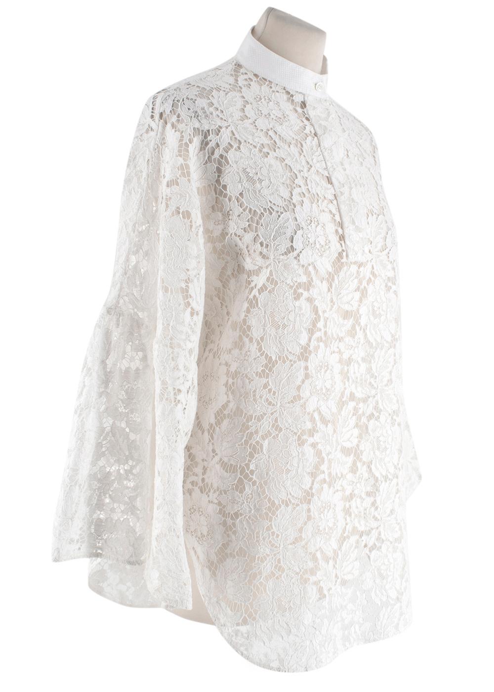 Valentino White Lace Cotton Blend Blouse

- Button up detail at collar 
- Whte Collar 
- Wide Sleeves
- High Neckline 
- Rounded Hemline with side slits 
- Flared Sleeve 

Materials 
71% Cotton
21% Viscose
8% Polyamide 

Dry Clean Only 

Made in