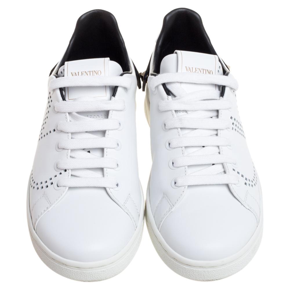 Amp up your off-duty wardrobe with Valentino's white Backnet trainers. They're crafted in Italy from smooth leather with a black Rockstud-embellished heel tab and V-logo perforations on the sides, then set on a monogram-debossed rubber sole. Style