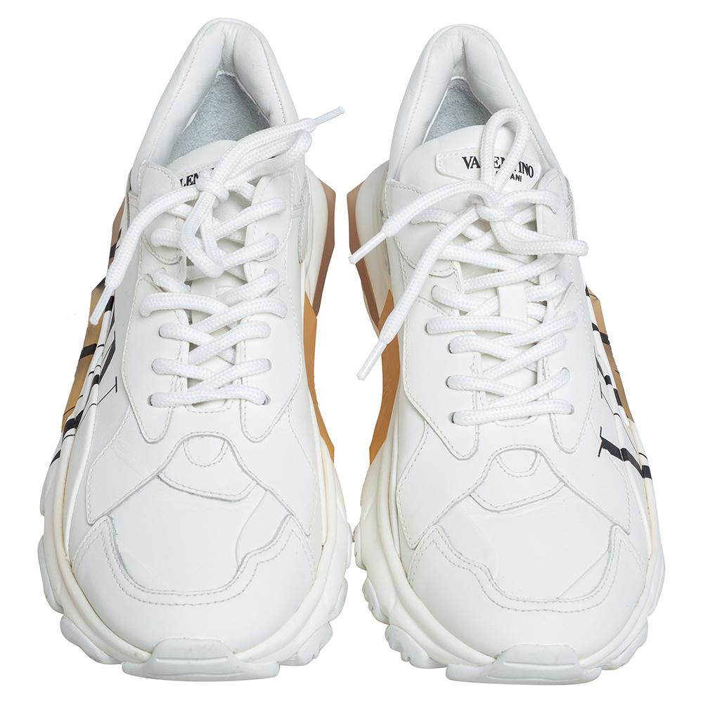 Amp up your off-duty wardrobe with Valentino's white sneakers. They're crafted in Italy from smooth leather with a contrasting black VLTN logo on the sides and chunky rubber soles. Style them with your casual separates.

Includes; Original Dustbag,