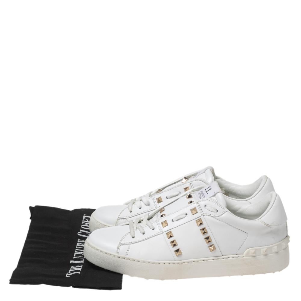 Impart a signature touch and appearance as you step out wearing these impeccable Rockstud sneakers from Valentino. Luxuriously styled, they are made from white leather on the exterior with gold-toned Rockstud accents highlighting their vamps. Sport