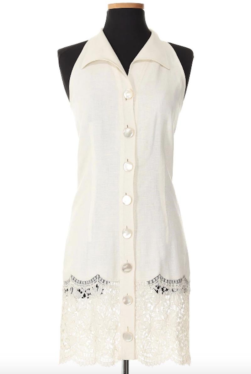 This 1980's Valentino look is in a crisp white with its delicate lace hem, this dress exudes timeless grace and femininity. Paired with the matching vest, it creates a beautifully coordinated ensemble. 

Bust 27 in
Waist 28 in
Hips 30 in 
Length 35