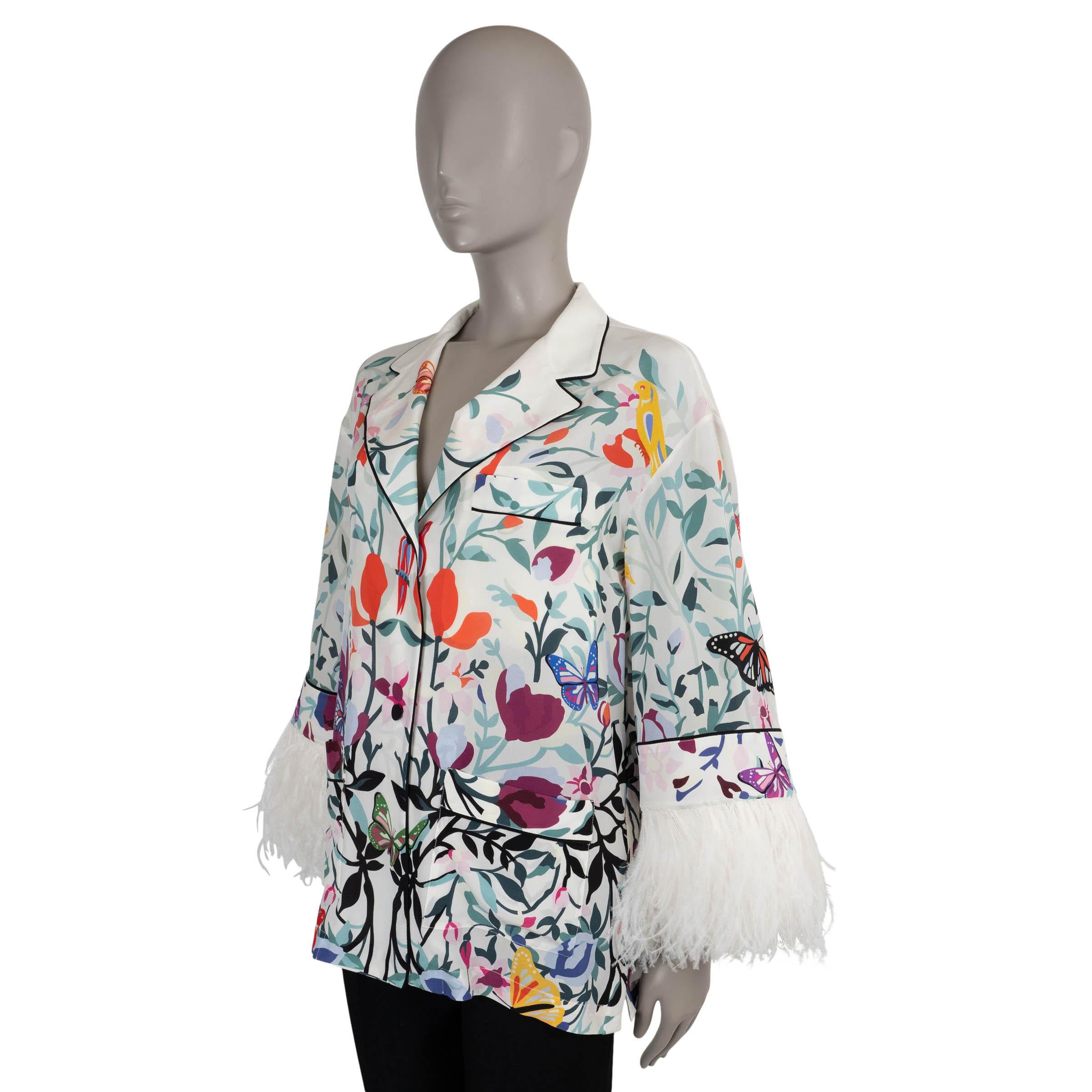 This 100% authentic Valentino pajama shirt is crafted in white crepe silk with a vibrant floral and butterfly print (please note the content and size tag are missing). Designed with a relaxed silhouette, it features notched lapels, patch pockets,