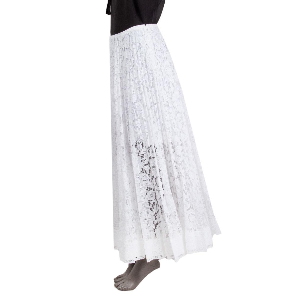 100% authentic Valentino sheer pleated lace maxi skirt in white viscose (43%), cotton (34%), polyamide (23%) (missing content tag). Closes with one hook and a concealed zipper on the side. Semi-lined in white cotton. Has been worn and is in