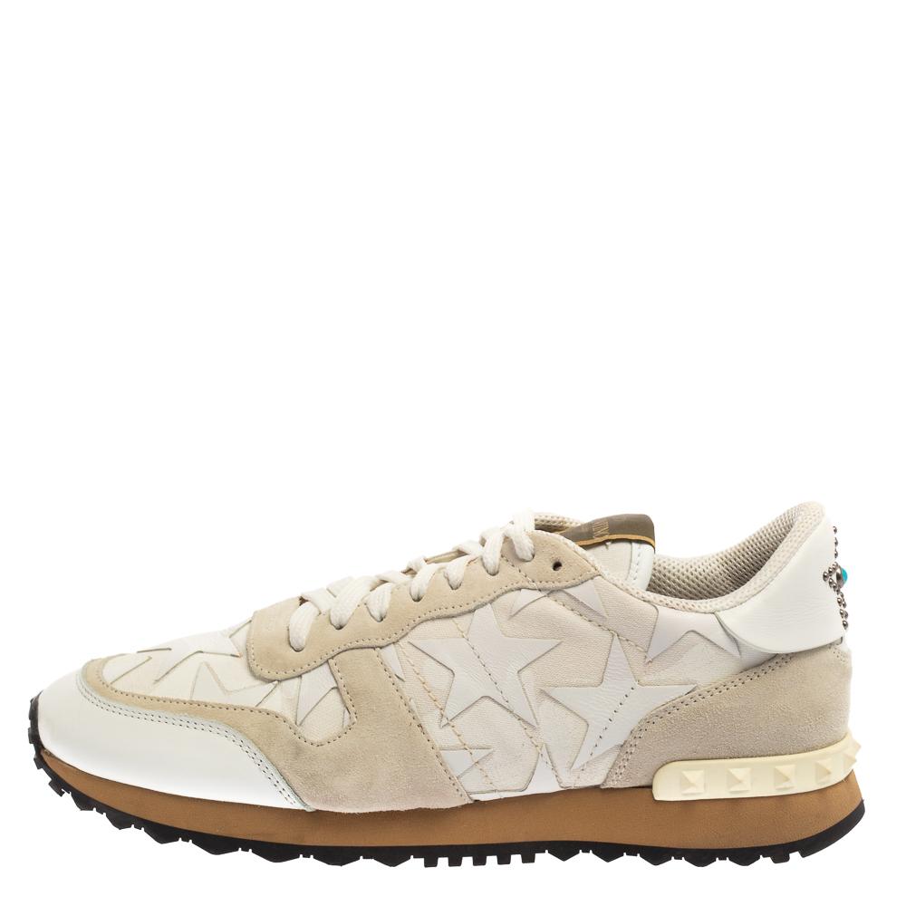 These white-hued Rockrunner sneakers from Valentino are made for the ones who want to stand out. Crafted from fine suede and canvas, these come with lace-ups on the vamps and pretty star detailing on the counters in addition to the Rockstuds and