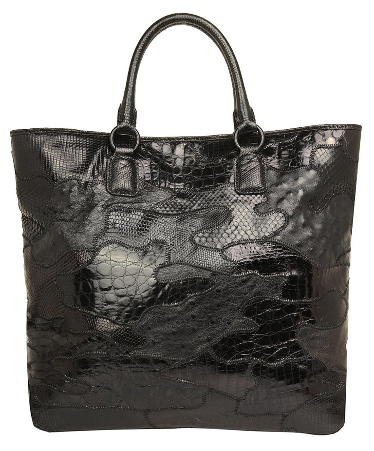 Item number 7WB00671-AMIP01-0NO 
Color black
Material Nile monitor-python-crocodile caiman-ostrich Leather
Lining 100% polyester
Compartments: 1 main compartment, 1 zipper pocket, 2 pockets
Dimensions width: 37 cm, height: 36 cm, depth: 10
