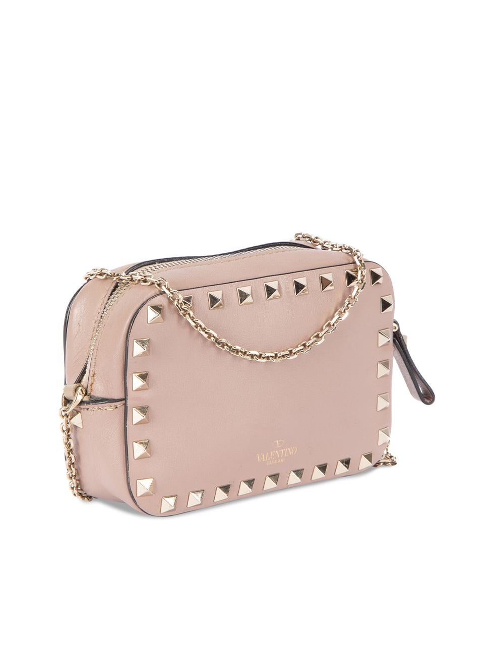 CONDITION is Very good. Minimal wear to bag is evident where scuffs and stain can be seen on the exterior and interior of bag on this used Valentino Garavani designer resale item.   Details  Pink Leather Mini crossbody bag Rockstud embellishment 1x