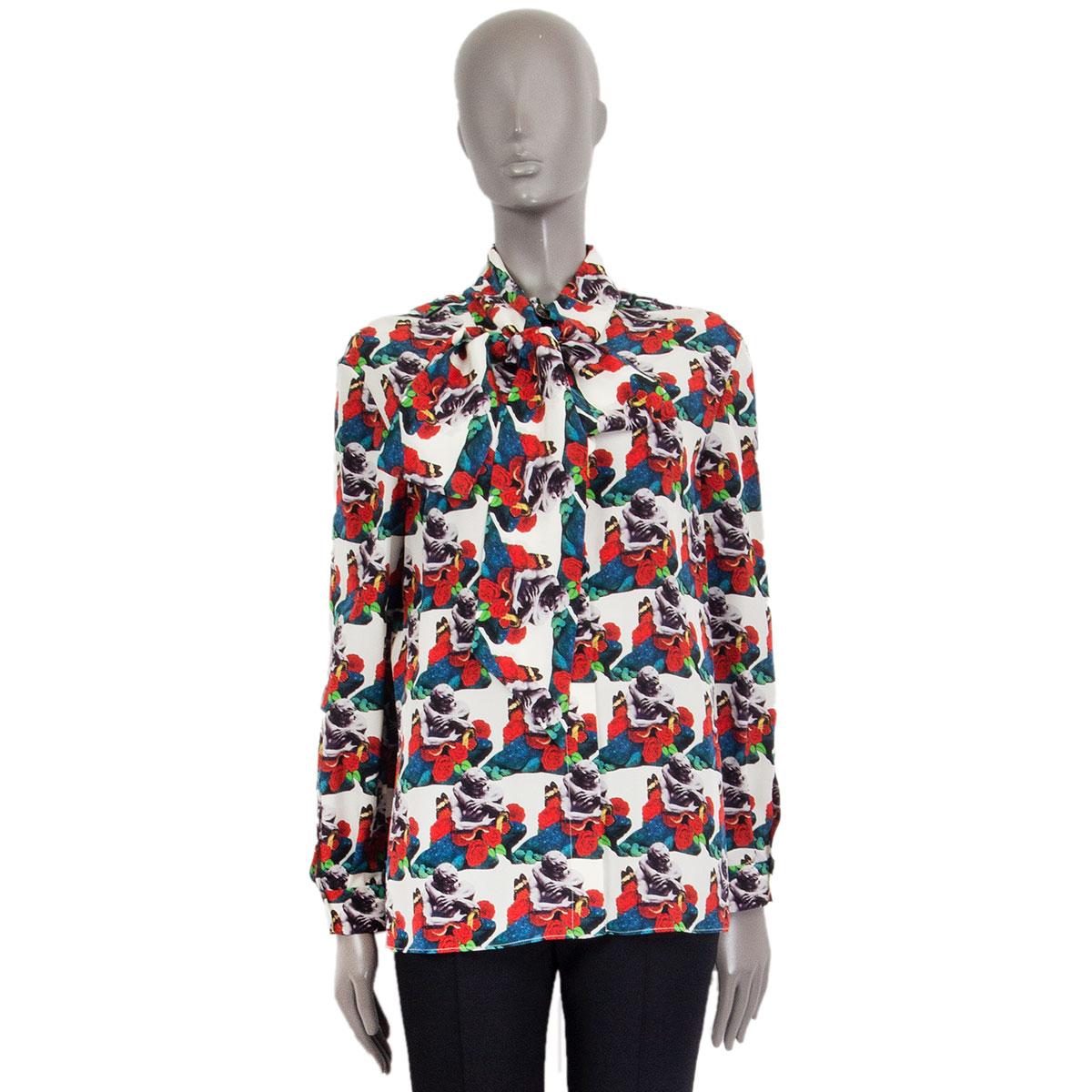 100% authentic Valentino x Undercover lovers print pussy bow blouse in off-white silk (100%) with multicolored print. Closes with concealed buttons on the front and has pleated buttoned cuffs, featuring ruches on the back. Unlined. Has been worn and