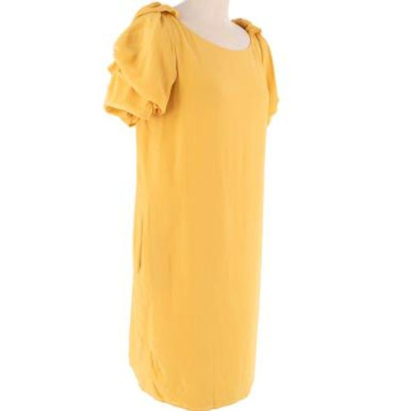 Valentino Yellow Ruched Shoulder Silk Dress

- Made of super soft silk.
- Shift Fit
- Keyhole back
- Frilled shoulders.

Made in Italy.
Do not wash.

PLEASE NOTE, THESE ITEMS ARE PRE-OWNED AND MAY SHOW SIGNS OF BEING STORED EVEN WHEN UNWORN AND