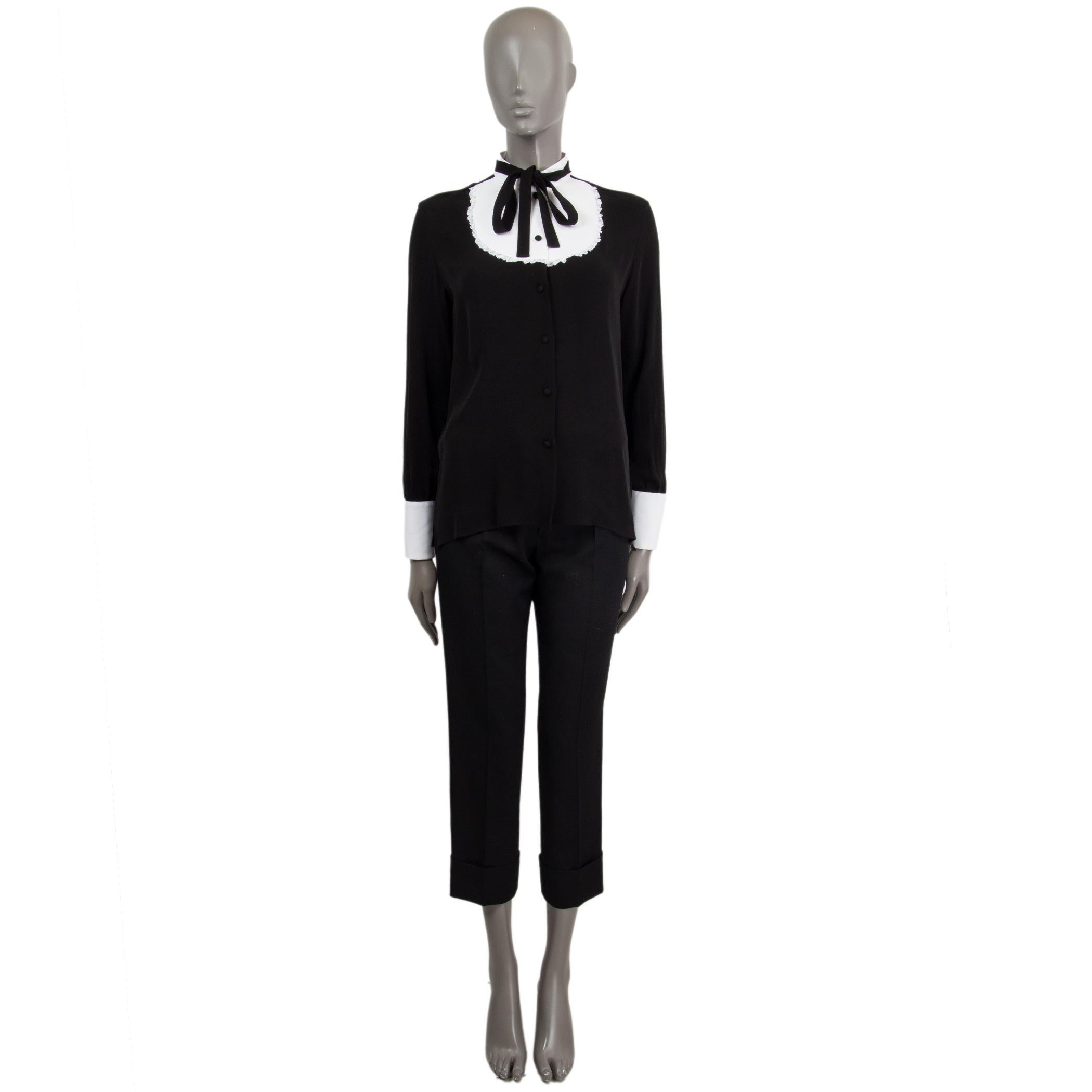 100% authentic Valentino long-sleeve plastron collar pussy bow blouse in black silk (100%) and collar and cuffs in white cotton (100%). Opens with covered buttons and is unlined. Has been worn and is in excellent condition. 

Measurements
Tag