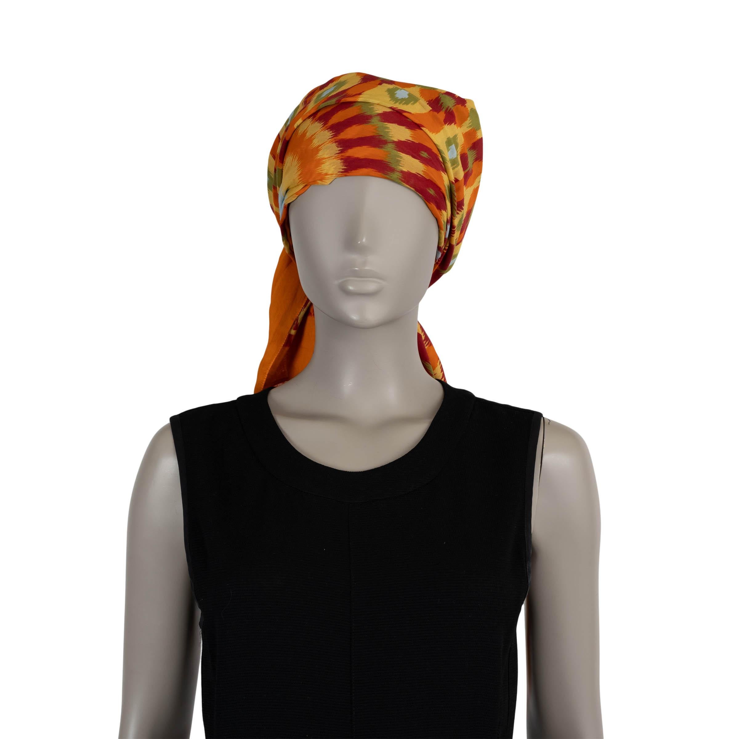 This 100% authentic Valentino headscarf in multicolor silk (56%) and cotton (44% - please note the content tag is missing) features a vivid kaleidoscope print that adds a bold, graphic touch to any look. Designed with a self-tie closure for