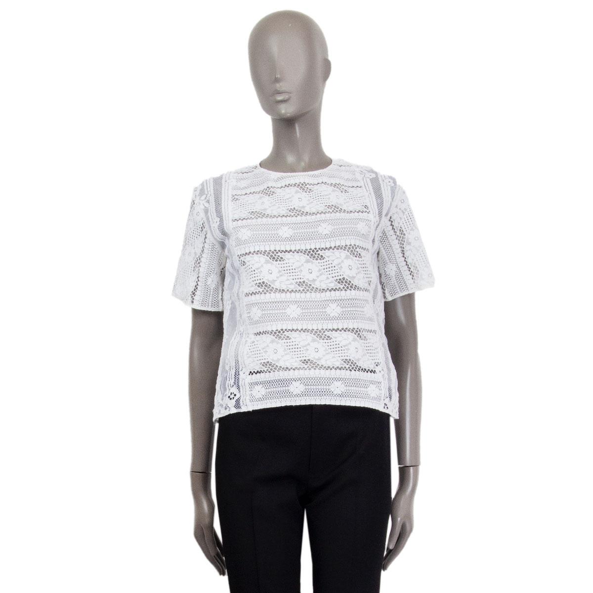 Valentino sheer short-sleeve round-neck lace top in white viscose (38%), cotton (34%) and polyamide (28%). Lined in white tulle. Keyhole and button closure. Has been worn and is in excellent condition. 

Tag Size 40
Size S
Shoulder Width 42cm