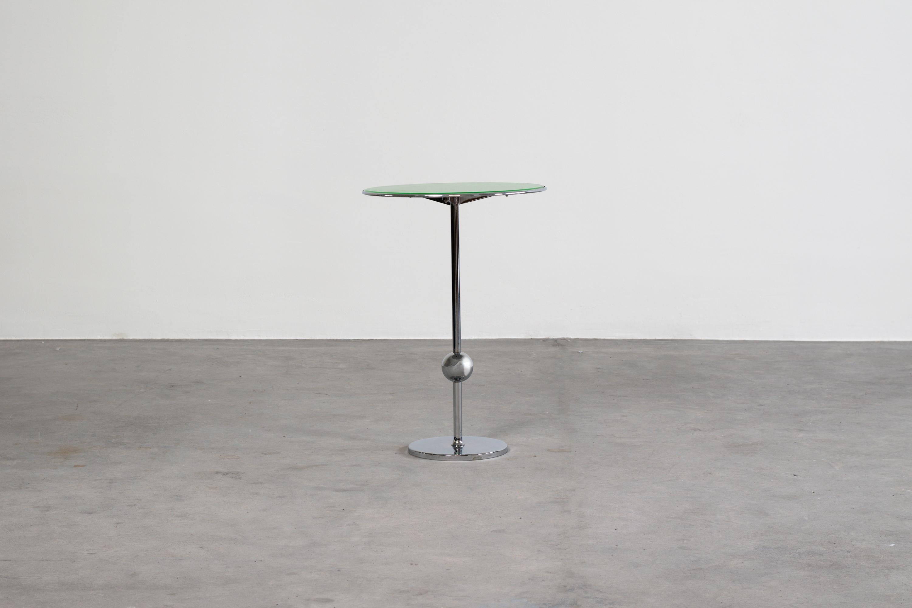 Service table from ABV series designed by Valeria Borsani and produced by Tecno, Varedo, 1991. 
Structure in chromed metal and back-painted glass top in green. 

Licterature: G. Bosoni, Osvaldo Borsani architect, designer, entrepreneur, Skira,
