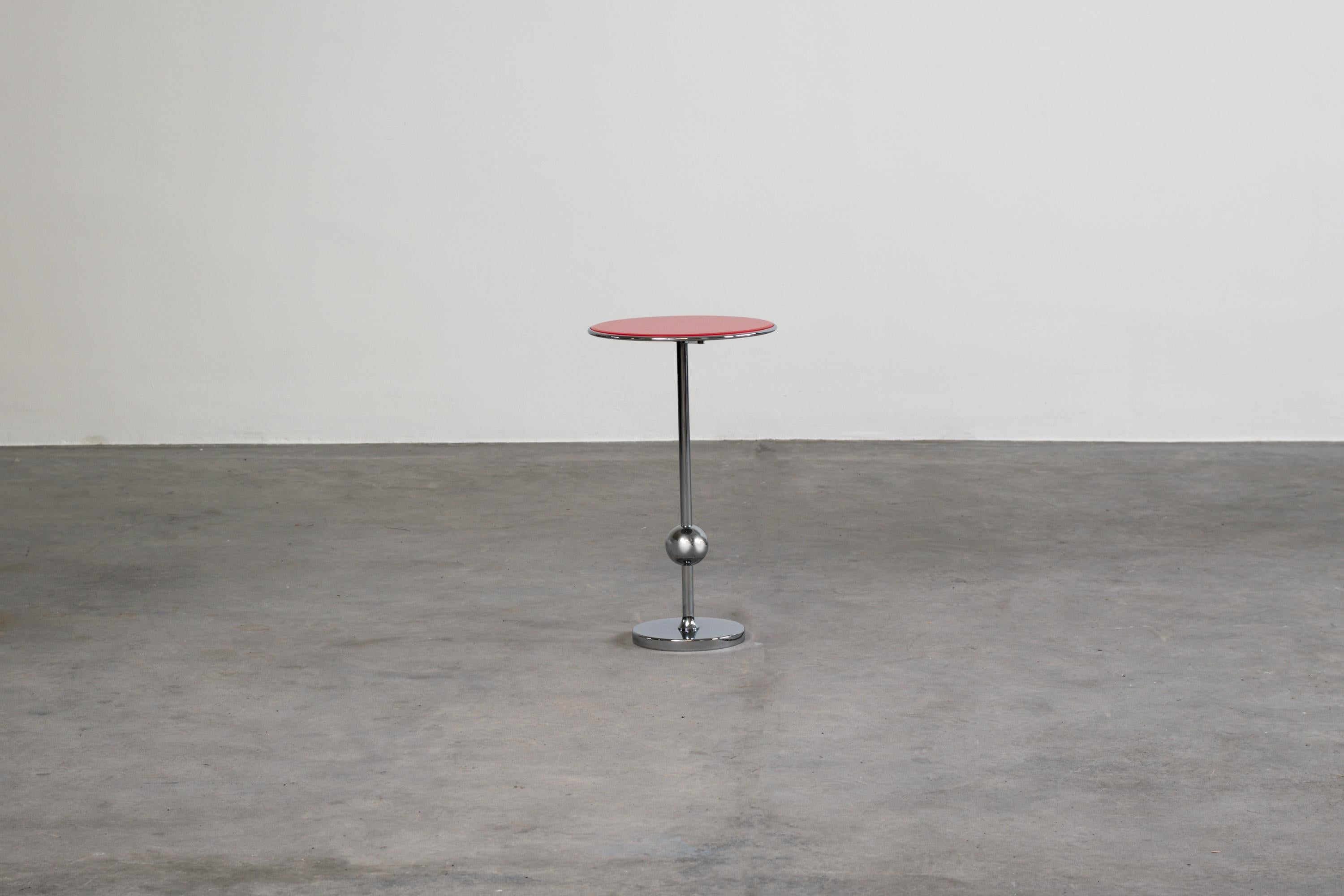 Service table from ABV series designed by Valeria Borsani and produced by Tecno, Varedo, 1991. 
Structure in chromed metal and back-painted glass top in red. 

Licterature: G. Bosoni, Osvaldo Borsani architect, designer, entrepreneur, Skira,