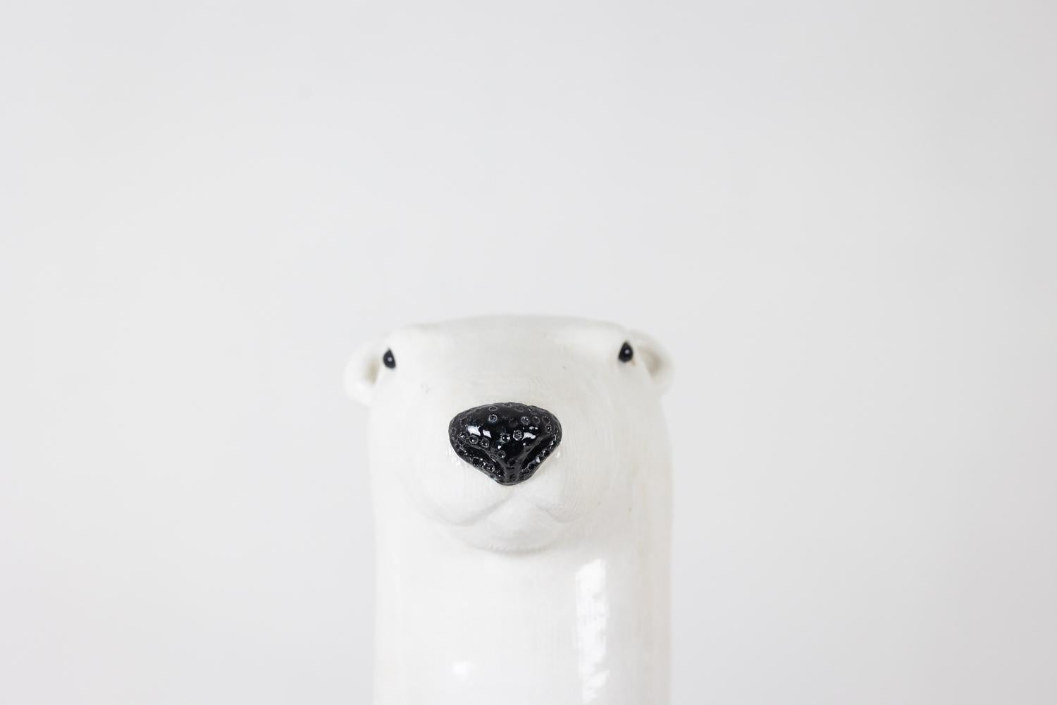 Valérie Courtet, by.

White bear in enameled stoneware, holding 3 animals in its arms. Work of a contemporary French artist.

Dimensions: H 59 x W 28 x D 14 cm

Reference: LS64211605M