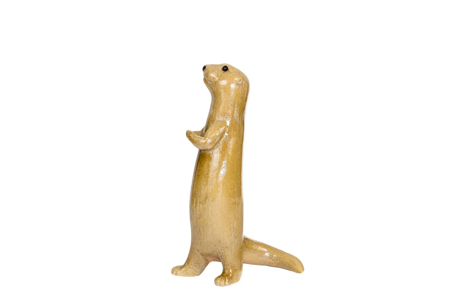 Valérie Courtet, signed.

Glazed stoneware sculpture figuring a stand otter on its back legs. Its tail slightly bent behind it. It holds its paws in front of its chest and slightly raised its head.

French contemporary work

Four other otters
