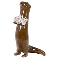 Valérie Courtet. Otter holding a fish. Contemporary.