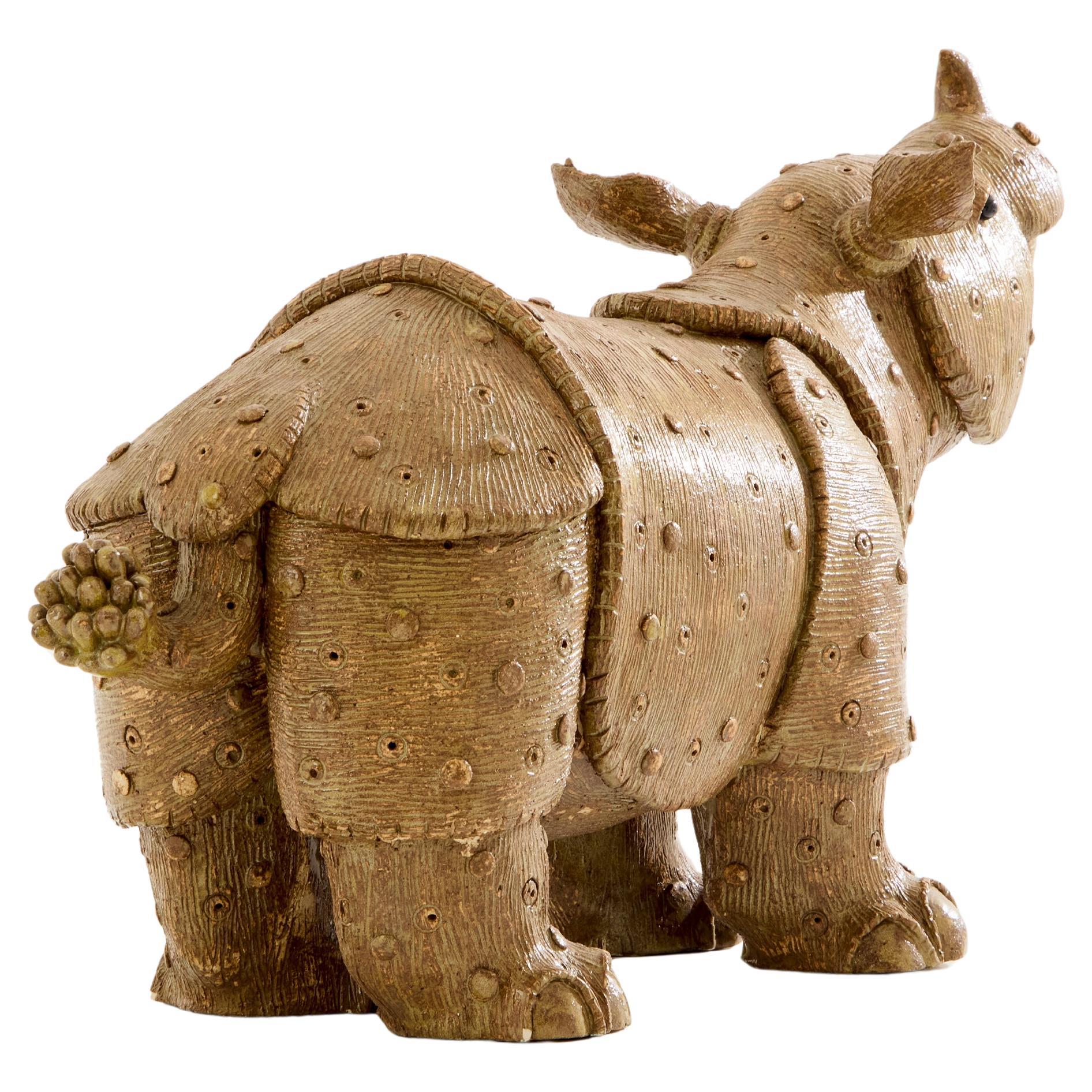 A beautiful glazed stoneware rhinoceros sculpture by Valérie Courtet, made around 2010. The details are truly exquisite, and the quality of the work is exceptional. Each piece by Valérie Courtet is unique and signed, with this rhinoceros being