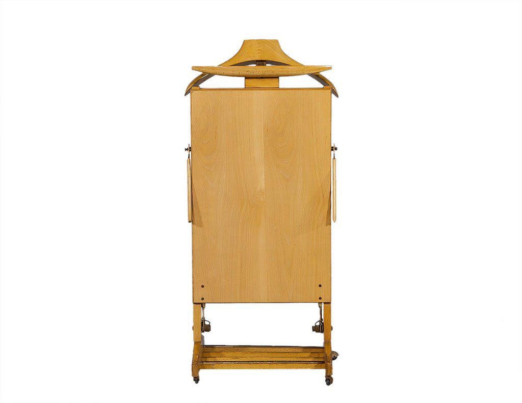 Vintage 1950’s beech wood valet with trouser press. Stamped with the logo of Fratelli Reguitti, made in Italy.

Matching stand in last photo is not included but available.