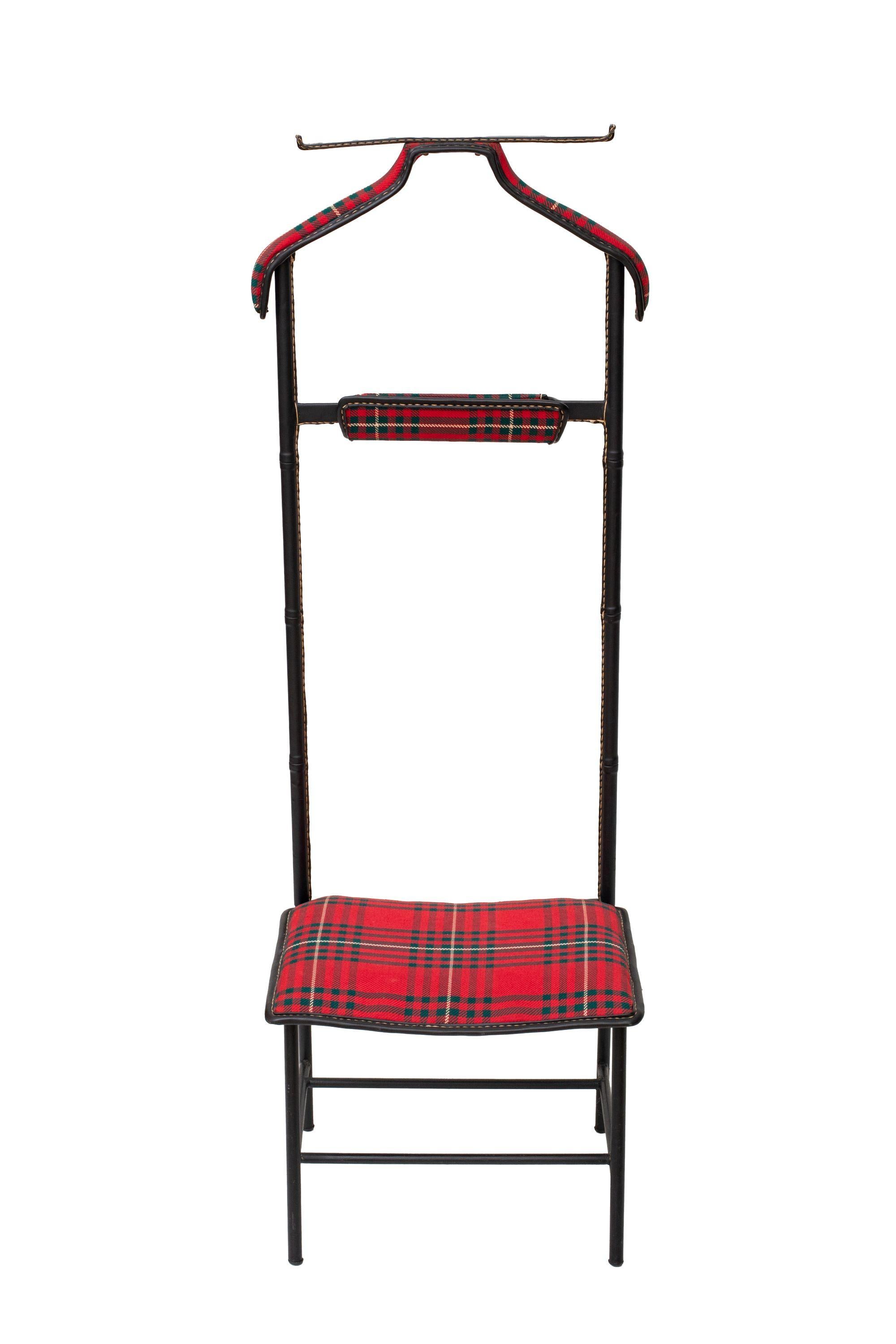  Valet with seat in black stitched leather and tartan plaid upholstery by Jacques Adnet
Newly upholstered with tartan fabric
Versatile and practical design, this valet features a coat stand, pant hanger, vide poche and a seat
Available to view