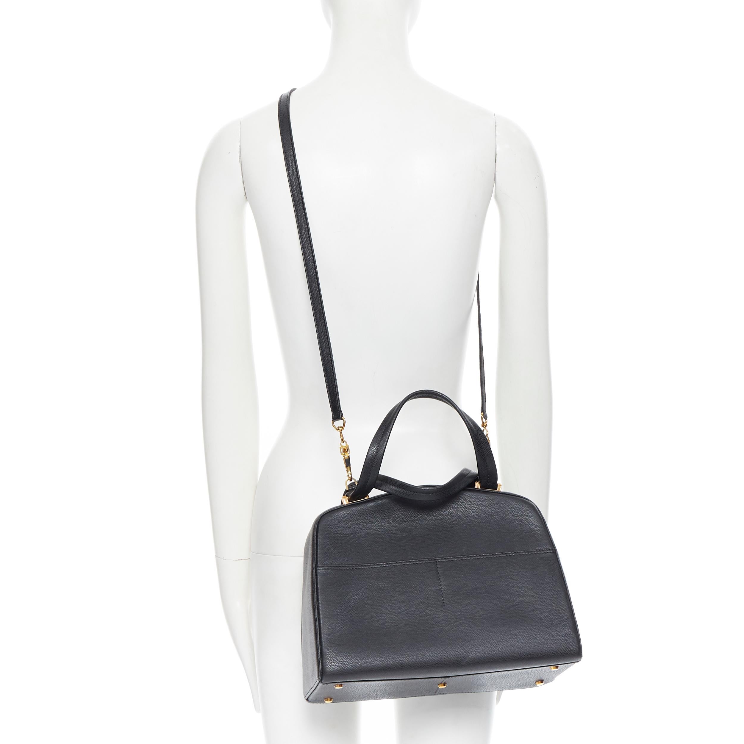 VALEXTRA black leather dual front pocket gold tone top handle shoulder bag 
Reference: LNKO/A01664 
Brand: Valextra 
Model: Minimal shoulder bag 
Material: Leather 
Color: Black 
Pattern: Solid 
Closure: Magnetic 
Extra Detail: Minimalist bag. Dual