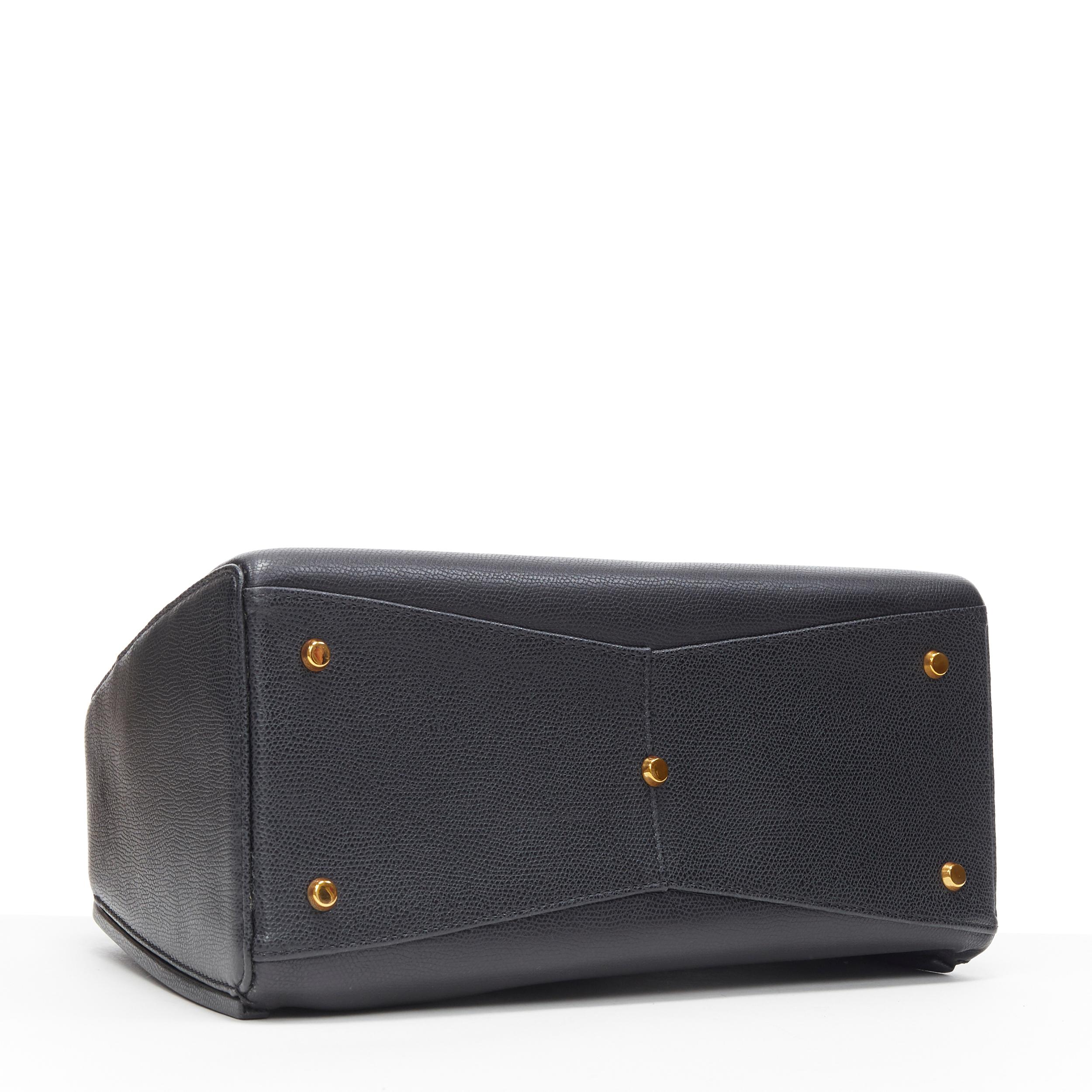 Black VALEXTRA black leather dual front pocket gold tone top handle shoulder bag