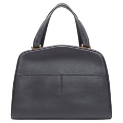 VALEXTRA black leather dual front pocket gold tone top handle shoulder bag