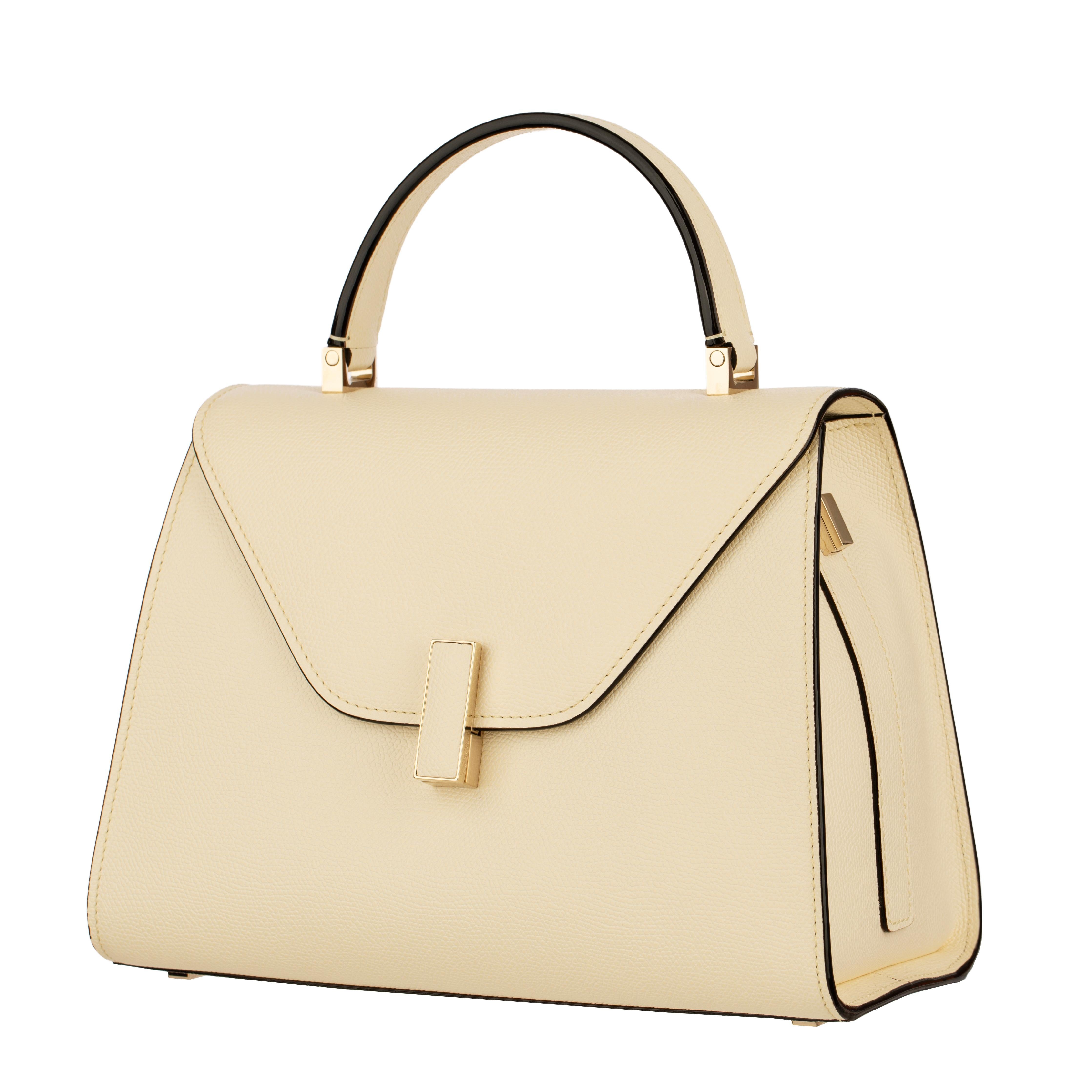 Icône moderne du design milanais raffiné, ce sac à main moyen Icone de Valextra en cuir grainé blanc Pergamena est l'exemple même du luxe tranquille. Fabriquée à la main en Italie avec une attention méticuleuse aux proportions et aux détails, la