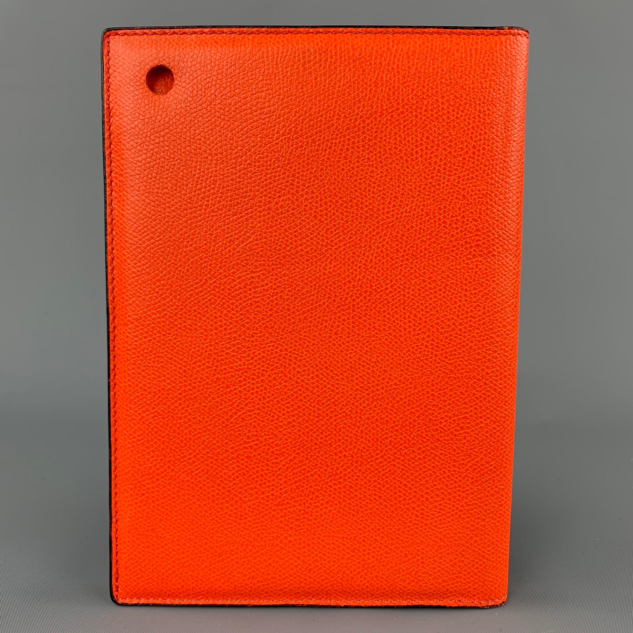 VALEXTRA iPad Case comes in a orange pebble grain leather featuring a bi-fold. Fits a iPad Mini.

Very Good Pre-Owned Condition.
Original Retail Price: $572.00

Case Measurements:

Height: 8.5 in.
Width: 6 in.