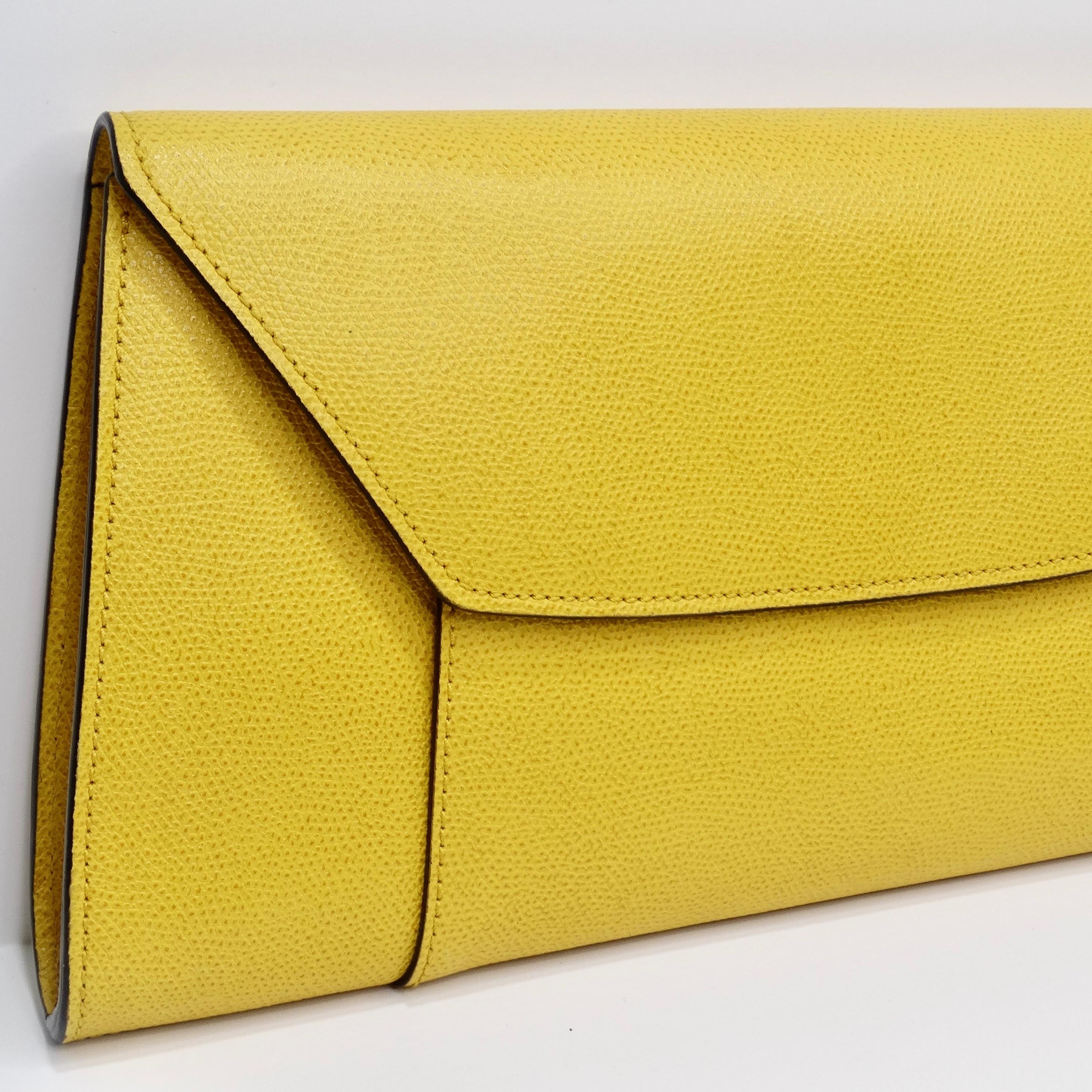 
Do not miss out on the Valextra Yellow Leather Clutch—a striking and contemporary accessory that will undoubtedly make a statement. This sleek rectangle clutch is a testament to modern design and high-quality craftsmanship. Crafted in a vibrant