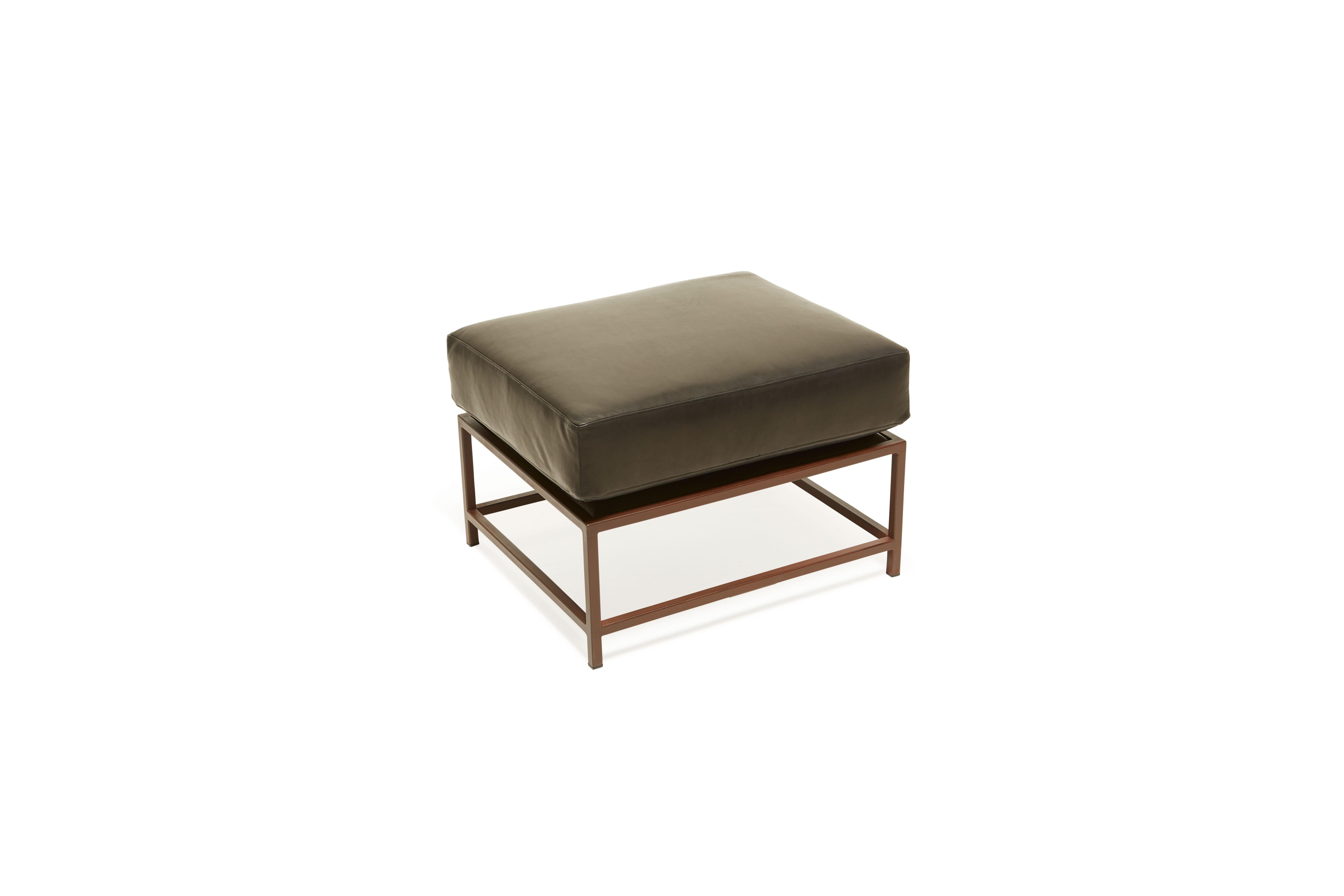 Designed to pair with any of the inheritance seating options, the ottoman is a great addition to add a lounge element to your seating arrangement. 

This variation is upholstered in a deep, dark granite leather. The foam seat cushions have been