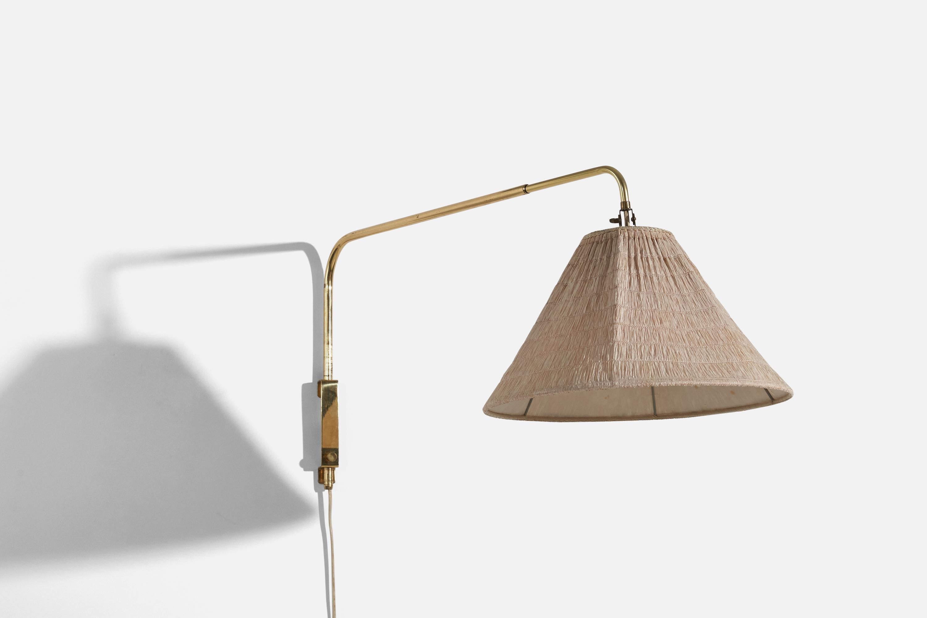 A brass and fabric wall light designed and produced by Valinte OY, Finland, 1950s. 

Variable dimensions, measured as illustrated in the first image. 

Dimensions of the back plate (inches) : 5.75 x 1 x 1.0625 (H x W x D)