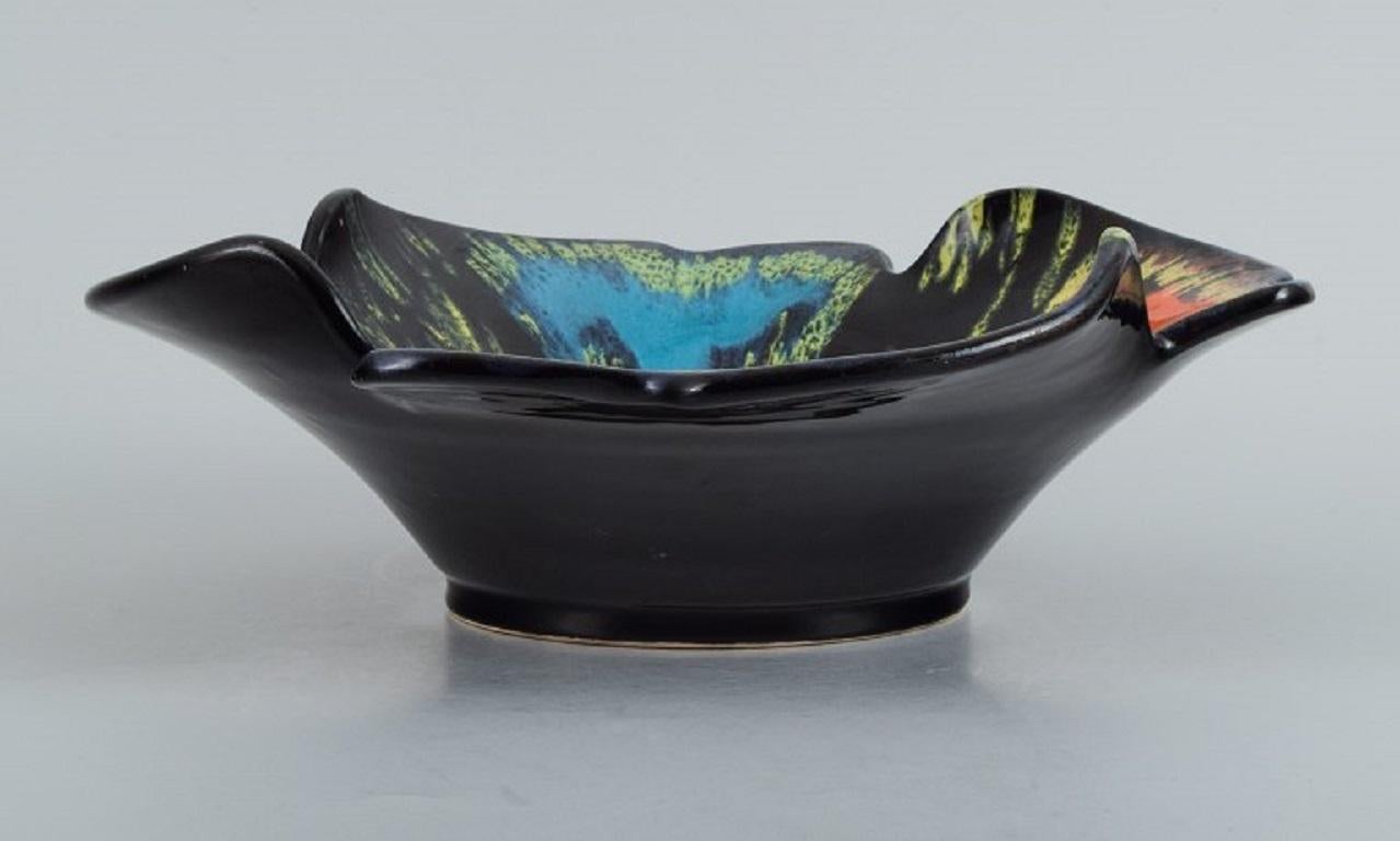 French Vallauris, France, Ceramic Bowl in Brightly Colored Glazes on a Black Base For Sale