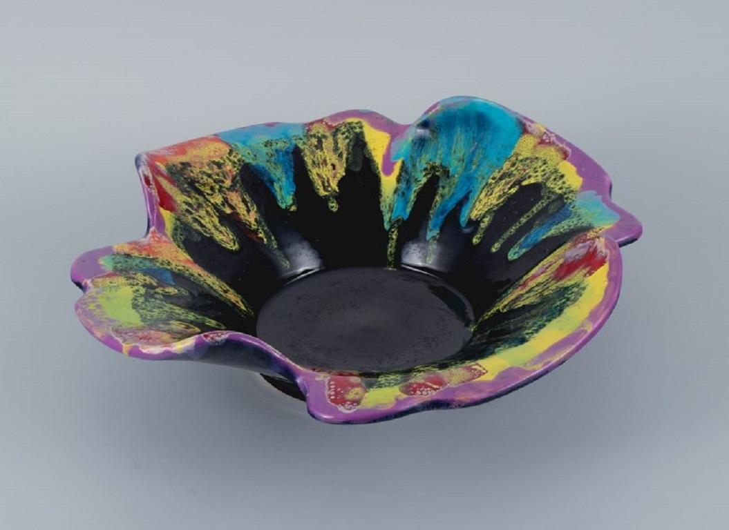 Vallauris, France.
Large ceramic bowl in multicoloured glaze.
Approx. 1970s.
In perfect condition.
Marked.
Dimensions: D 35,0 x H 8.0 cm.