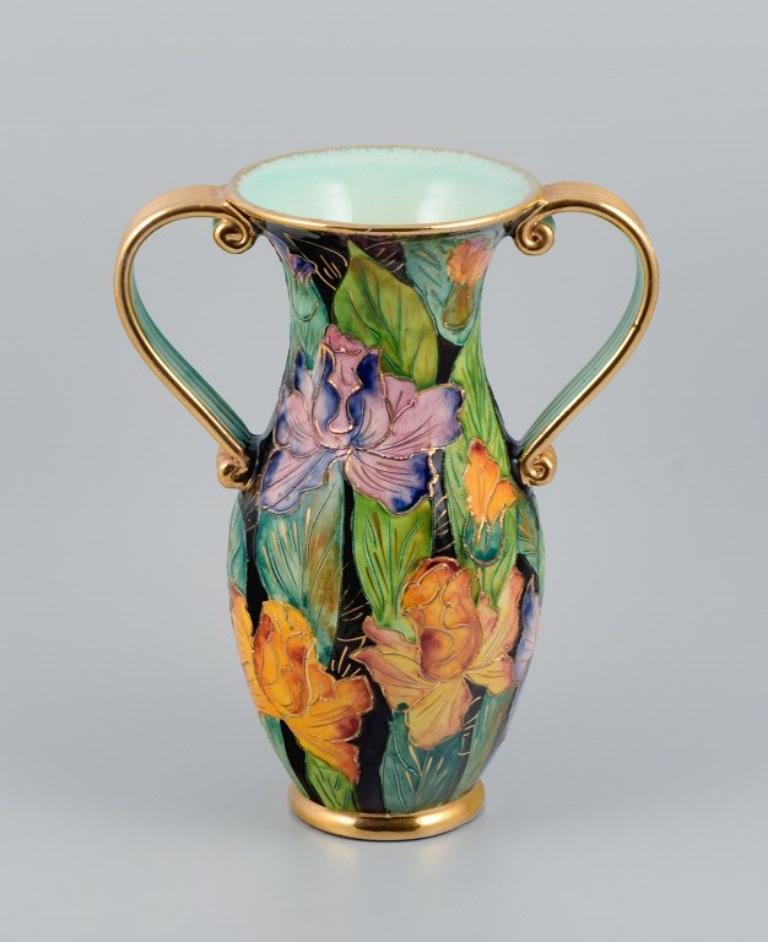 Vallauris, France, large ceramic vase decorated with floral motifs and gold handle.
Approx. 1930s.
Perfect condition.
Marked.
Dimensions: H 30.5 x D 14.0 cm.