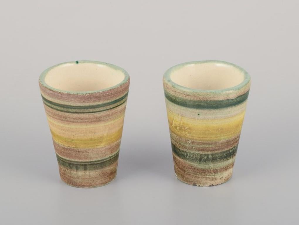 Vallauris, France. A set of eight unique ceramic mugs.
Polychrome glaze.
Approximately 1970.
In excellent condition with a few chips at the bottom.
Dimensions: H 6.2 cm x D 4.9 cm.