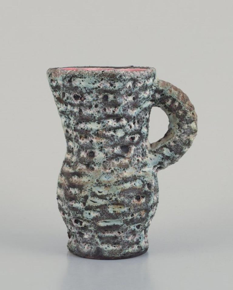 Vallauris, France. Small ceramic pitcher. 
Raku fired glaze with an orange interior.
1960s/70s.
Perfect condition.
Dimensions: Height 14.0 cm x Diameter 11.0 cm.