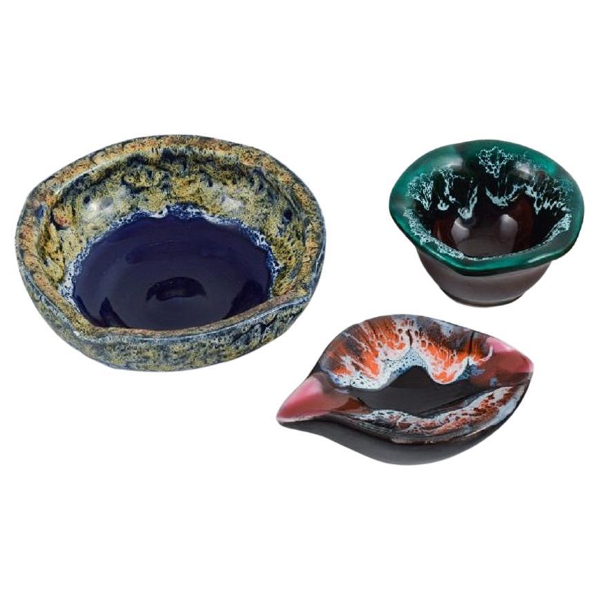 Vallauris, France, three ceramic bowls in brightly colored glazes. 1960/70s.