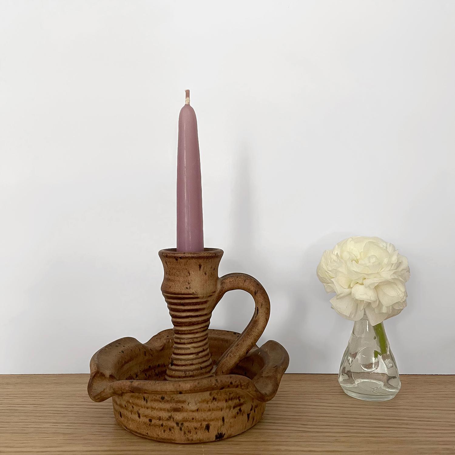 French ceramic earthenware candle holder
Vallauris France 
Organic composition and feel 
Neutral toned ceramic piece
Natural color variations throughout
Holds a single candle, not included 
Patina from age and use
Last photo is for reference