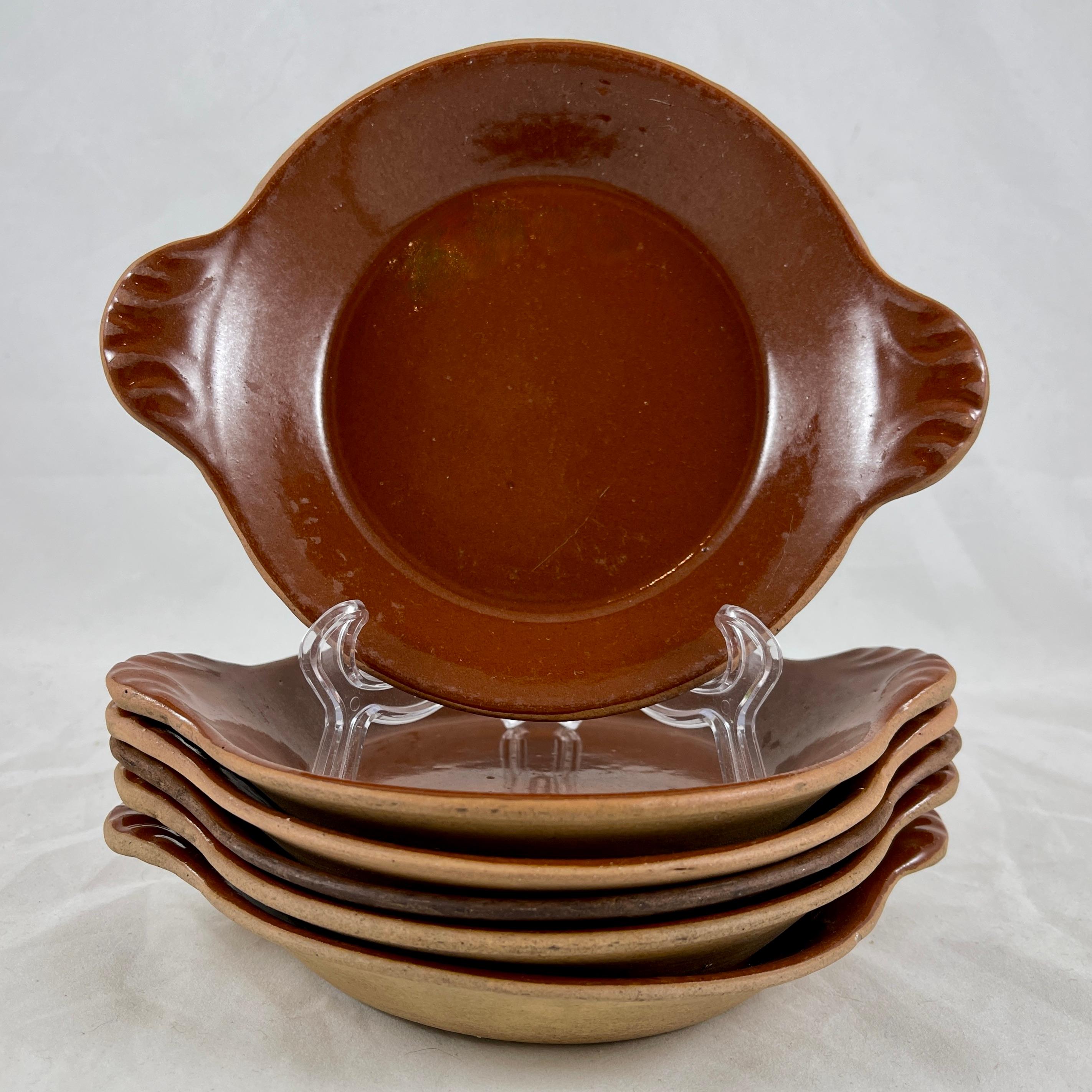 A set of six pottery au gratin dishes, Vallauris, France, circa 1930s.

A traditional rustic design, these Treacle glazed shallow, handled open-proof dishes are perfect for preparing and serving individual Croque Monsieur or Croque Madam