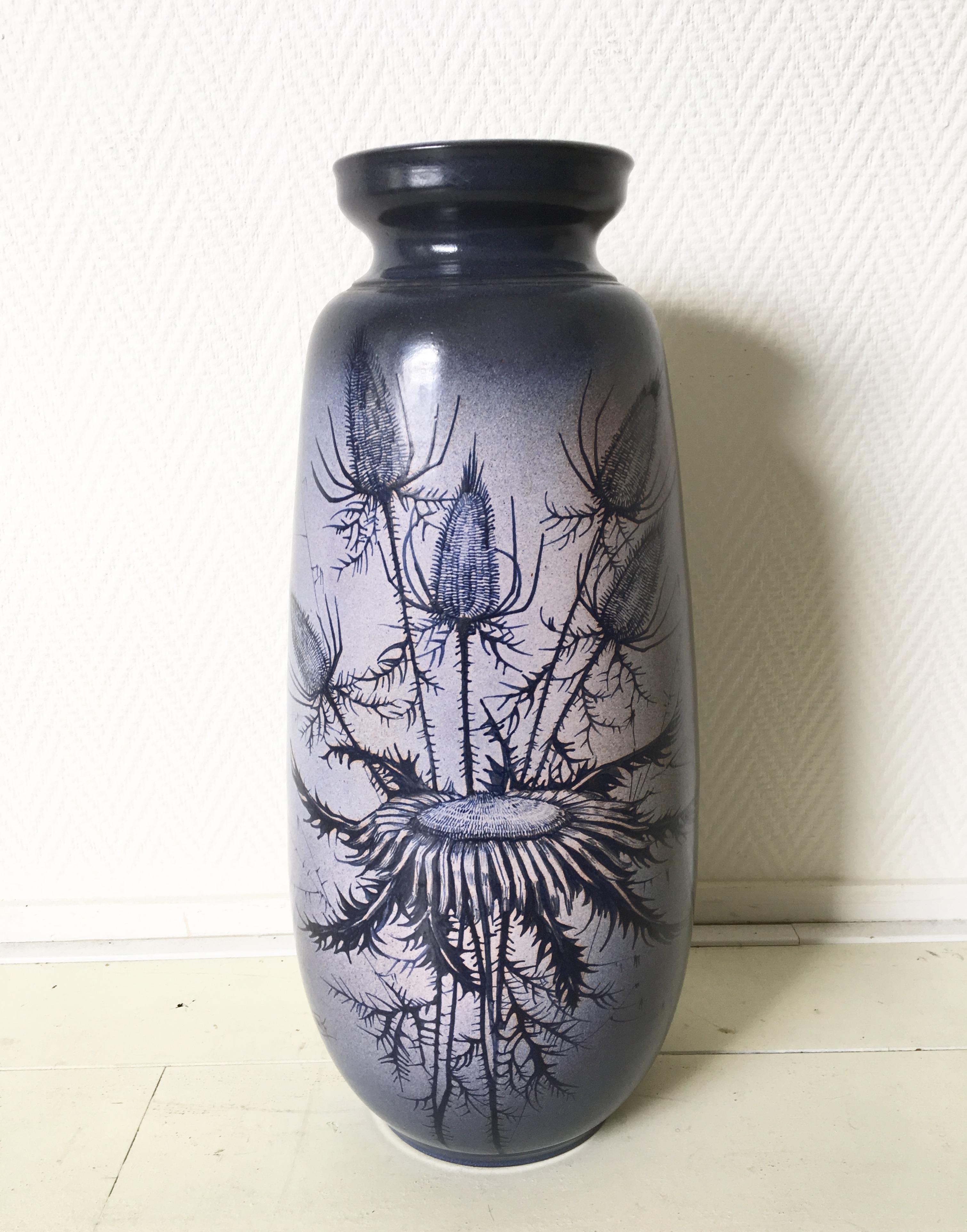 This unusual vase was designed by Jaques Fonck et Jean Mateo for Vallauris, circa 1960s. Floral decoration consisting of Thistle and Sunflowers. This large piece remains in excellent condition. Signed. 