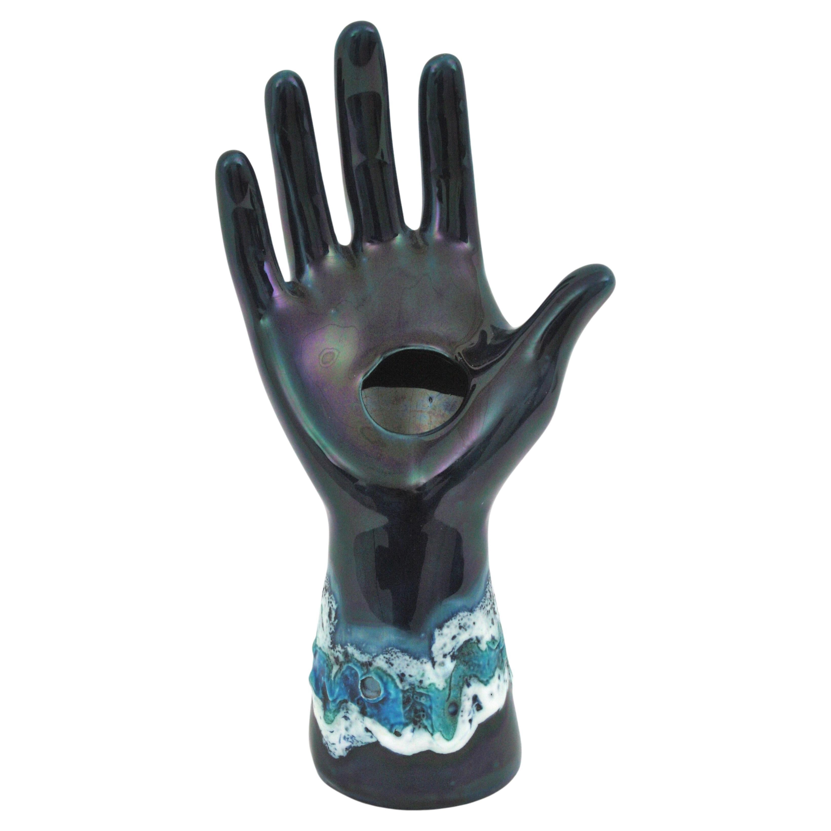 Mid-Century Modern Blue Glazed Ceramic Hand Sculpture by Vallauris. France, 1950s
Eye-catching iridiscent blue ceramic hand vase with fat lava details in shades of blue and white glazed ceramic
Beautiful from all sides.
To be used as rings display