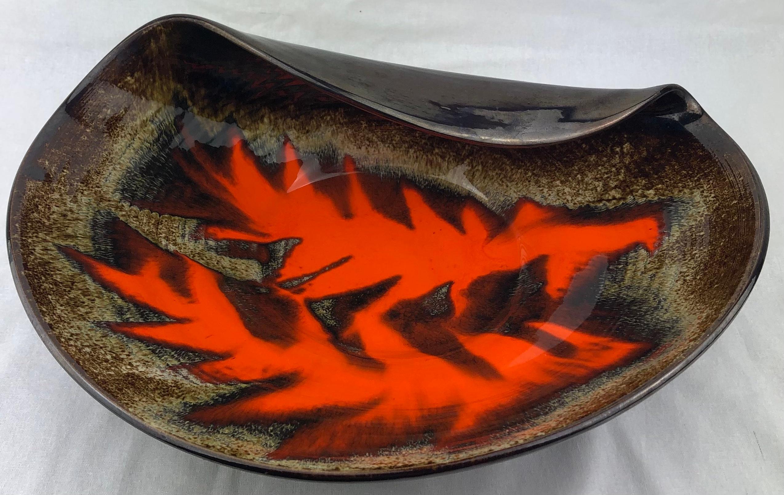 A stunning decorative sculpted bowl with a glazed finish in two stunning mid-century traditional colors. 
The design is in the manner of Gilbert Valentin. 

Measures: 14 3/4