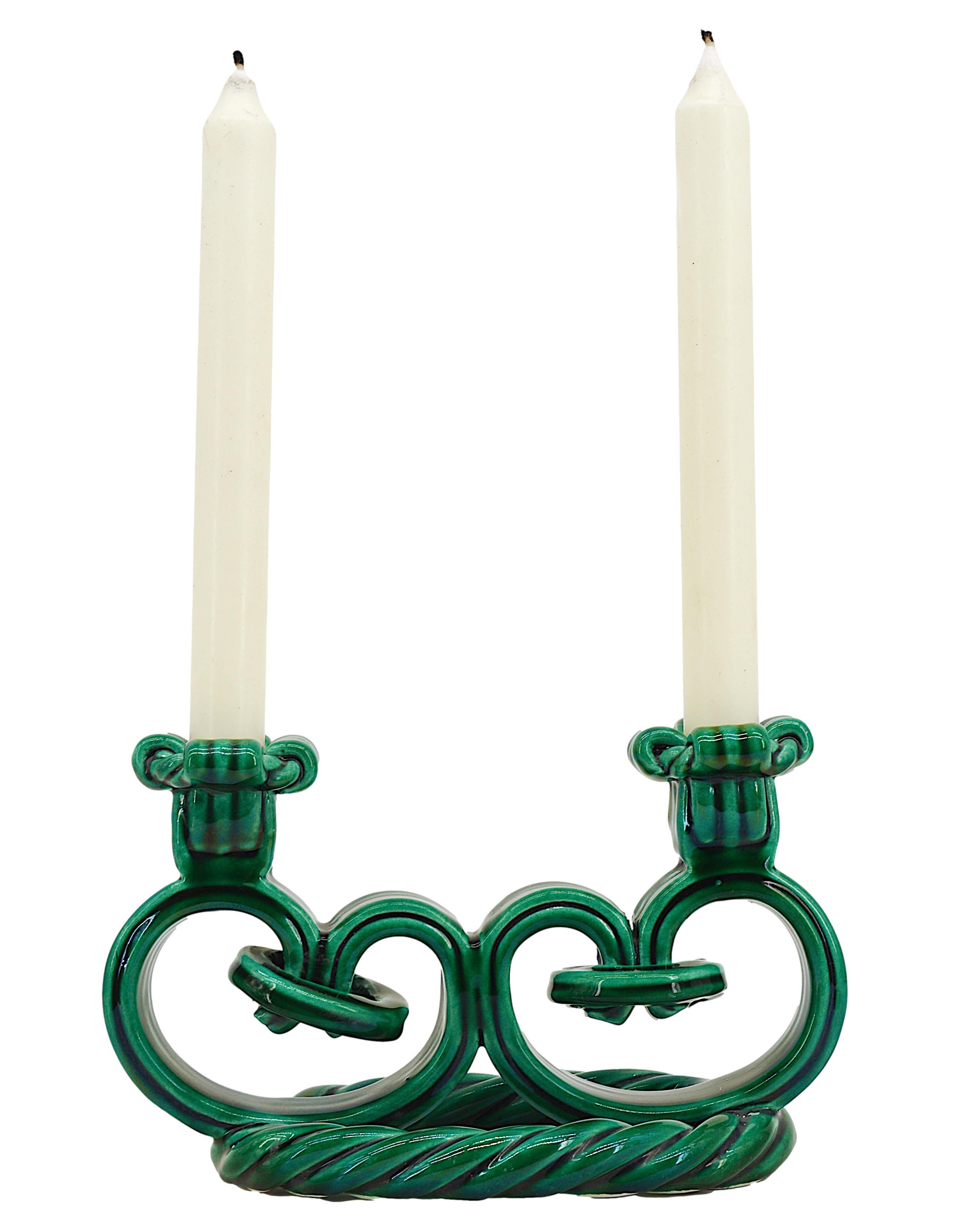 Pair of candlesticks made at Vallauris, France, 1940s. Ceramic. Representation of braided candlesticks, Classic design from this period of the 40s. Very close to the work of Jérome Massier. Each - Width: 8.9