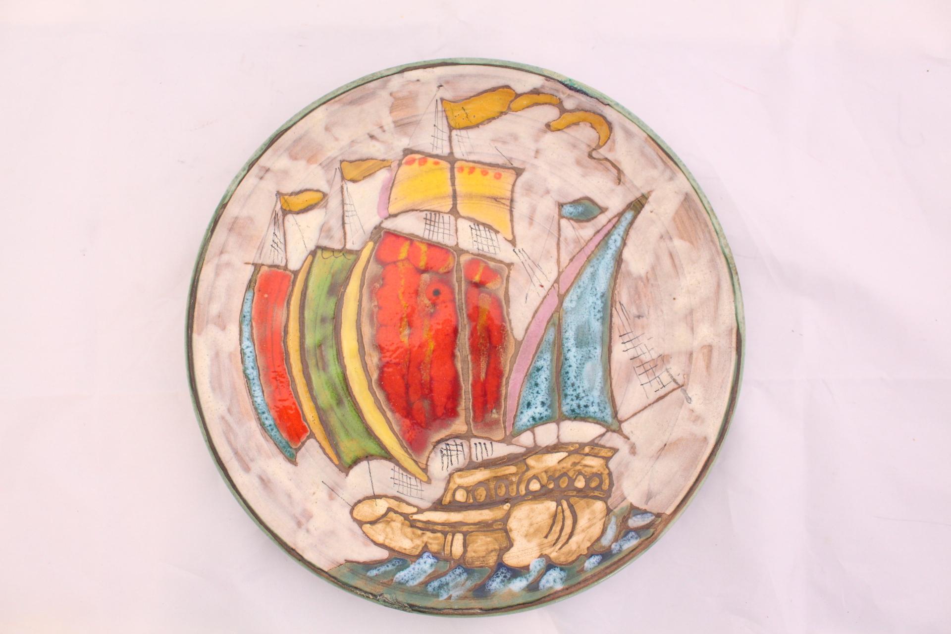 Midcentury plate unique Vallauris hand painted
Stylised Galleon at Sea 
Stylish and decorative great addition to Provençal collection of Art Studio Pottery 
Good condition with two small old restorations to the edge please see photos.
 